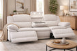 White sectional sofa in a living room setting with decor elements.